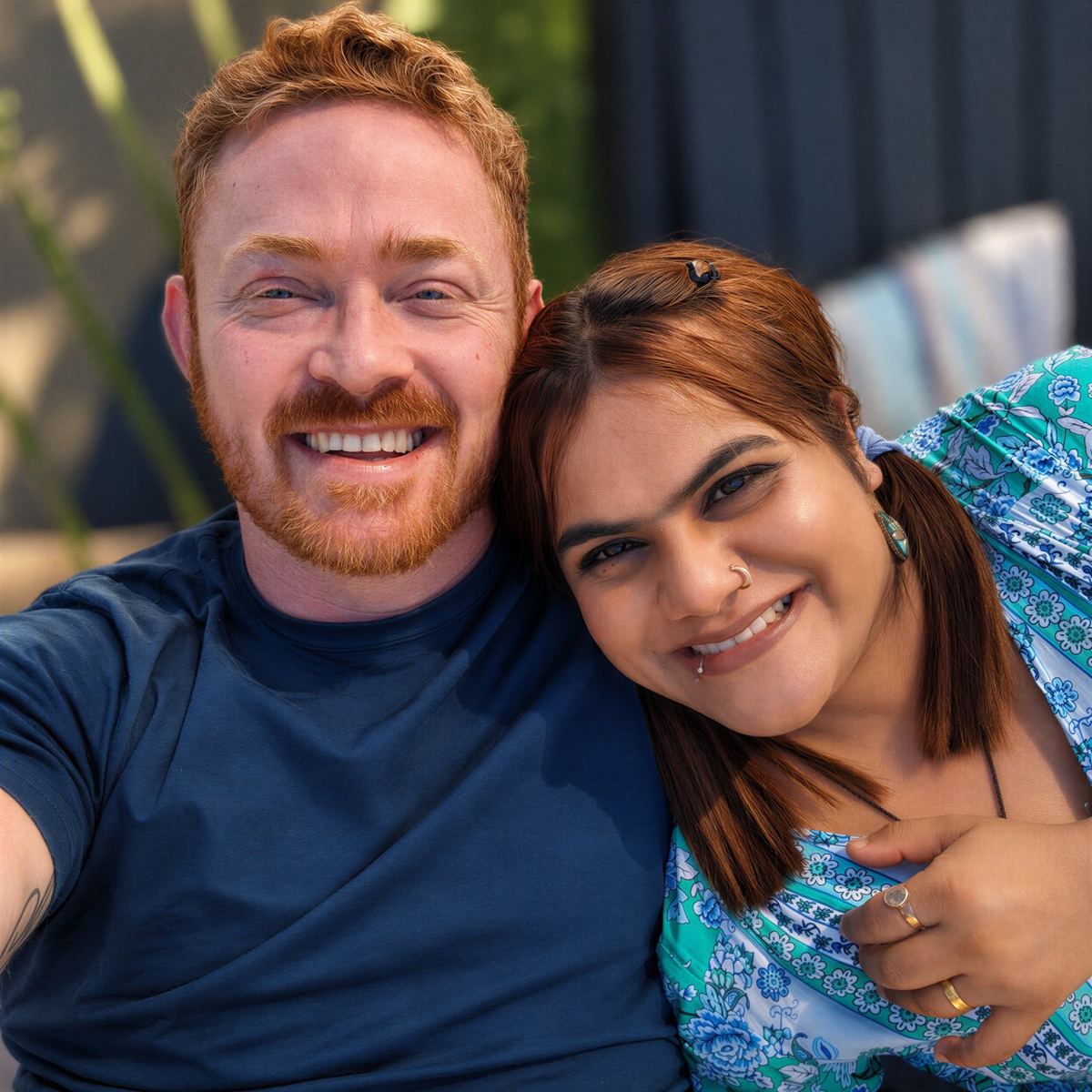 Ryan and Chetna smiling together in a close selfie